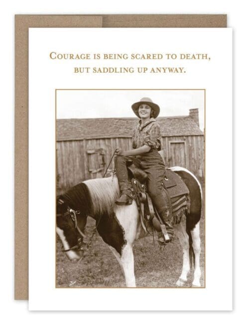 Cowgirl courageously rides horse.