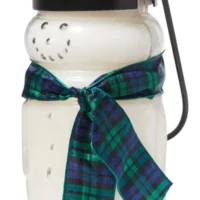 Snowman candle with plaid ribbon.