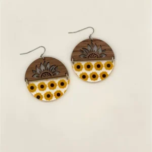 Pair of 2.25" round earrings- Top half of the circles are walnut wood with a laser cutout of a sunflower. The bottom half of the circle is clear acrylic with repeating rows of yellow sunflowers with dark brown centers. The two halves are joined by tiny metal rings.