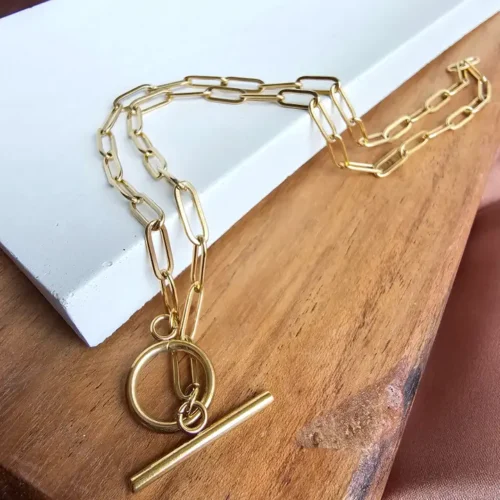 Gold chain necklace with toggle clasp.