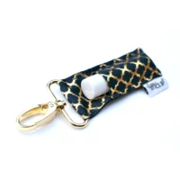 Gold and navy lip balm keychain.